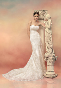 Style #1529L, fit and flare lace wedding gown, available in light ivory