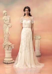 Style #1555, fit and flare lace wedding dress with short sleeves, available in ivory