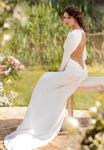 Style #1415, long sleeve fitted wedding gown with open back, available in ivory