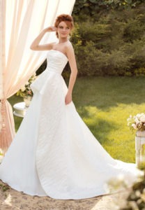 Style #1425, jacquard a-line wedding gown with peplum skirt, available in ivory