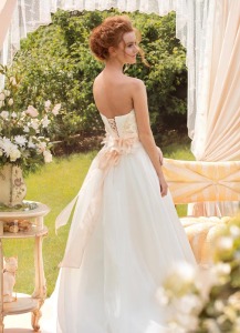 Style #1434, blush a-line wedding gown with lace bodice and silk flowers, available in pink-ivory
