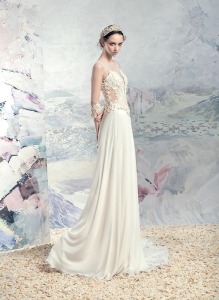 Style #1602L, illusion back sheath wedding dress with sheer sleeves and lace details, available in ivory