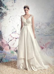Style #1610, plunging neckline jacquard a-line wedding dress with beaded belt and train, available in cream