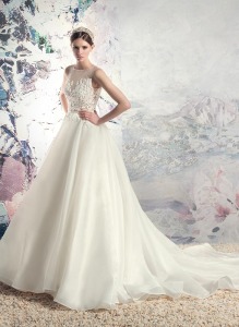 Style #1638L, a-line wedding dress with organza skirt and beaded lace bodice, available in cream
