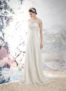 Style #1652L Premium, lace sheath wedding gown with cap sleeves and plunging back, available in cream