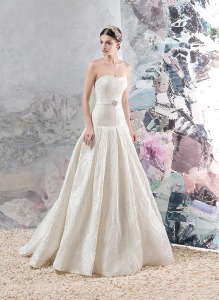 Style #1656, jacquard A-line wedding gown with pleated skirt and beaded belt, available in ivory