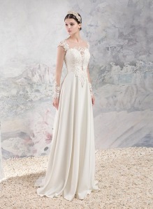 Style #1659, sheath wedding gown with plunging neckline, illusion long sleeves and lace appliques, available in ivory