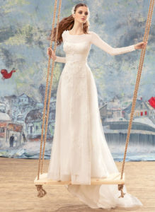 Style #1701L, A-line wedding dress with 3-D floral embroidery, and long chiffon sleeves, available in ivory
