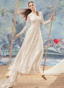 Style #1705L, long sleeve A-line wedding gown with lace appliques and embroidery, available in ivory