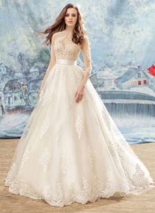 Style #1707L, spaghetti strap ball gown wedding dress with beaded lace bodice and lace appliques down the skirt; comes with a separate 3/4 sleeve illusion lace bolero, available in ivory (with nude cup), ivory (with ivory cup)