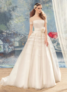 Style #1722L, stripe detail ball gown wedding dress with illusion neckline, short sleeves and hand-made flower decor, available in ivory