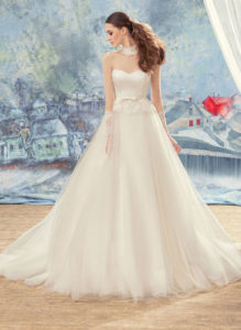 Style #1724L, tulle ball gown wedding dress with illusion sleeves and sweetheart bodice, available in ivory