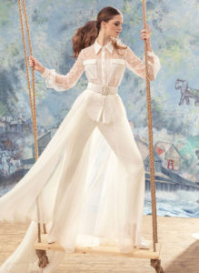Style #1725, lace button up long sleeve blouse with fitted trousers and organza skirt, available in cream