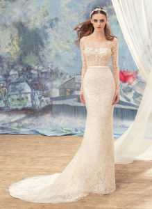 Style #1727L, beaded lace fit and flare wedding gown with sheer bodice and long sleeves, available in ivory