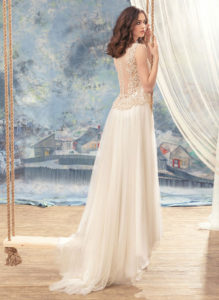 Style #1738L, illusion back A-line wedding dress with lace bodice details and pleated tulle skirt, available in ivory