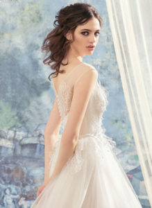 Style #1743L, tulle ball gown wedding dress with illusion lace bodice and hem details, available in ivory