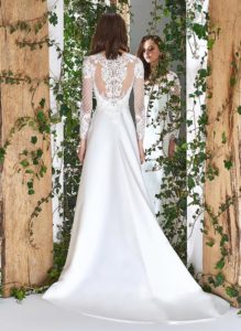 Style #1809L, long sleeve modified a-line wedding dress with illusion neckline and low back, lace embroidered top and satin skirt, available in ivory