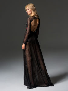 Style #354, long sleeve sequinned evening gown features flower 3-D embroidery on the top, velvet belt, keyhole open back, and a full-length sheer skirt, available in black