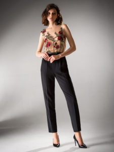 Style #430-8, Jumpsuit with illusion bodice and flower applique, available in powder, ivory, black, red