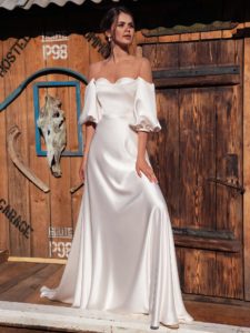 Style #12072, off-the-shoulder wedding dress with bishop sleeves, available in ivory