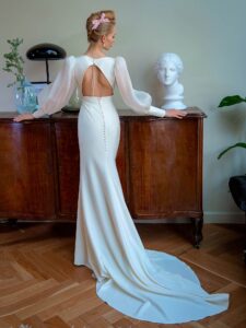 Style #2208L, V-neck fit and flare wedding dress with organza bishop-style sleeves, available in ivory