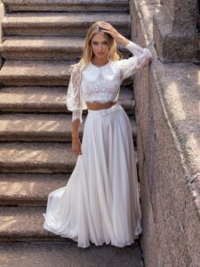 Two-piece bridal set with lace long-sleeve crop top and flowy chiffon skirt