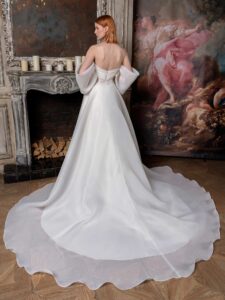 Off-the-shoulder A-line wedding dress with a draped bustier bodice