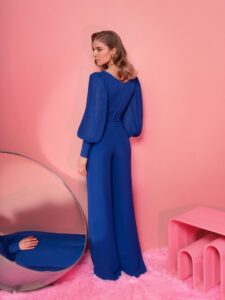 Style #805-8, V-neck jumpsuit with long bishop sleeves; available in cornflower blue (shown online), powder, ivory, grey, cherry, grey-blue, purple, black, red, ivory