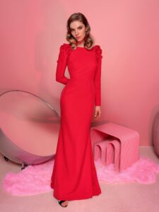 Style #809, long-sleeved fit and flare evening gown with open back; available in red (shown online), ivory, blue, powder, black, white, green, grey, dark blue