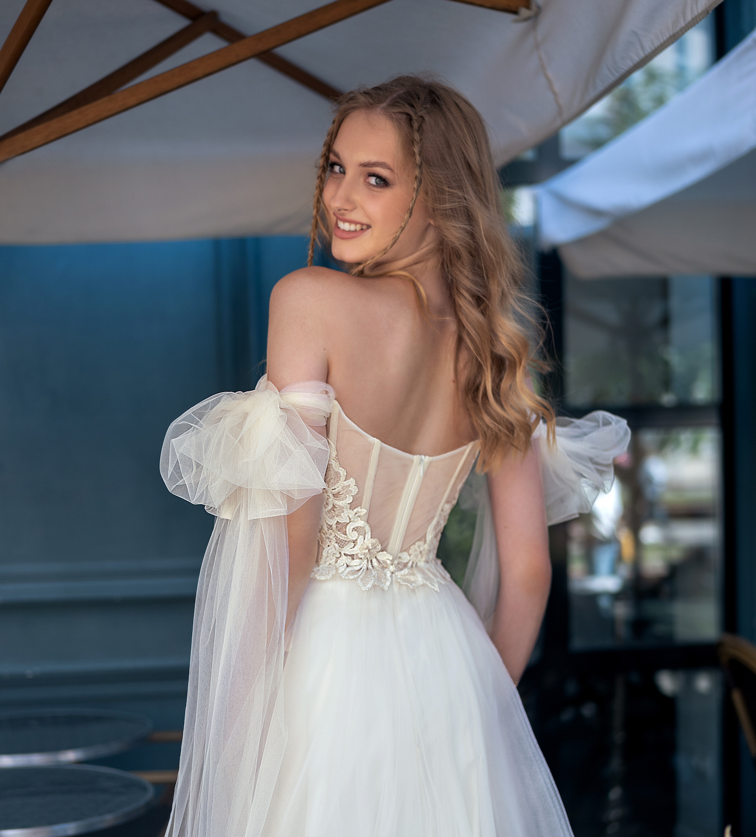 Chic short wedding dress with delicate floral appliqués and bow accents – affordable bridal styles from the Weekend collection in Toronto.