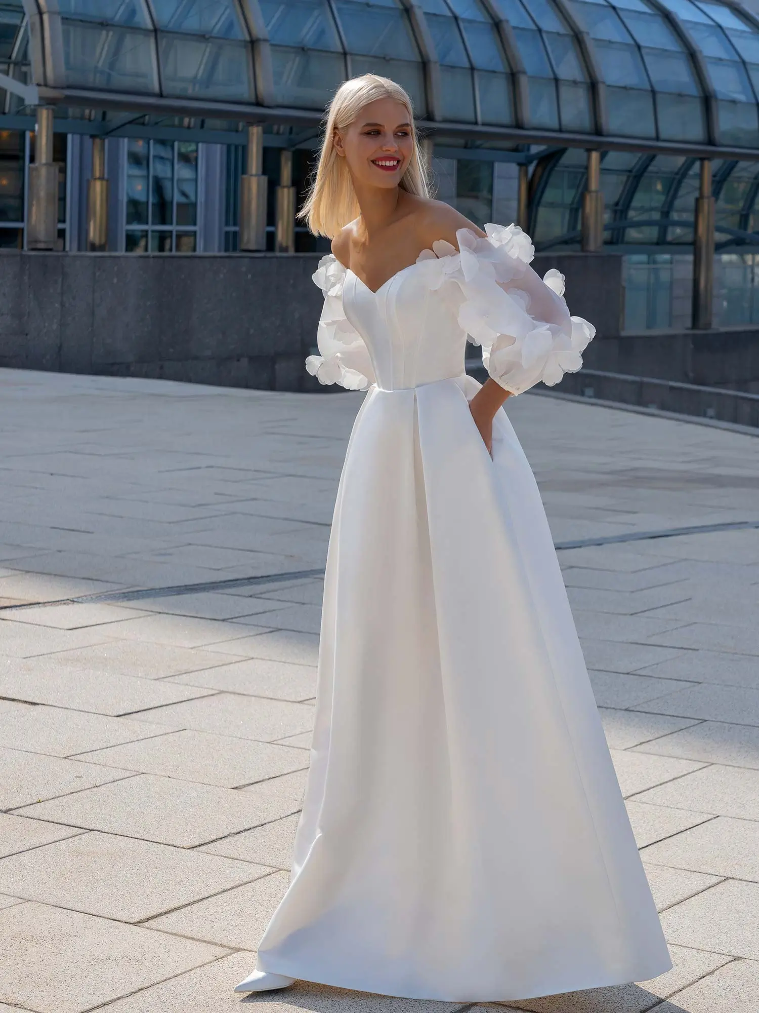 Best Wedding Dress for Body Type - Pear Shaped: A-line wedding dress with a structured corset bodice, sweetheart neckline, and voluminous floral sleeves, perfect for balancing proportions. Available at Papilio Boutique in Toronto.