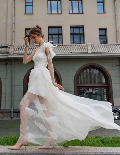 Full-length view of a bride in a romantic silhouette organza wedding dress, by Papilio Boutique Toronto bridal store.