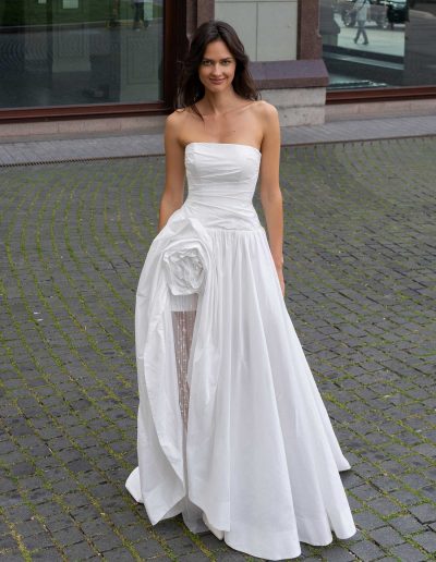 Close-up of a strapless neckline on a sexy wedding dress with an open leg feature, by Papilio Boutique Toronto bridal store.