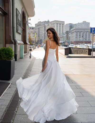 Elegant back view of a lightweight organza wedding gown with spaghetti straps, by Papilio Boutique Toronto bridal store.