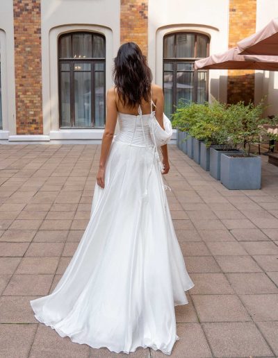 Back view of a sweetheart A-line bridal gown with asymmetrical shoulder, showcasing delicate details, by Papilio Boutique Toronto bridal store.