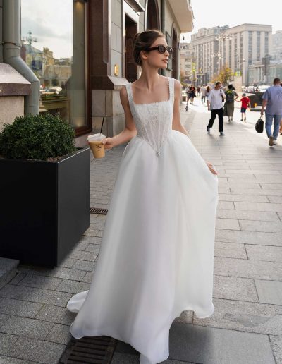 Elegant basque waist bridal gown with intricate lace bodice, perfect for a chic wedding, by Papilio Boutique Toronto bridal store.